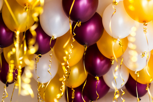 An image of white, yellow and burgundy balloons for the blog.