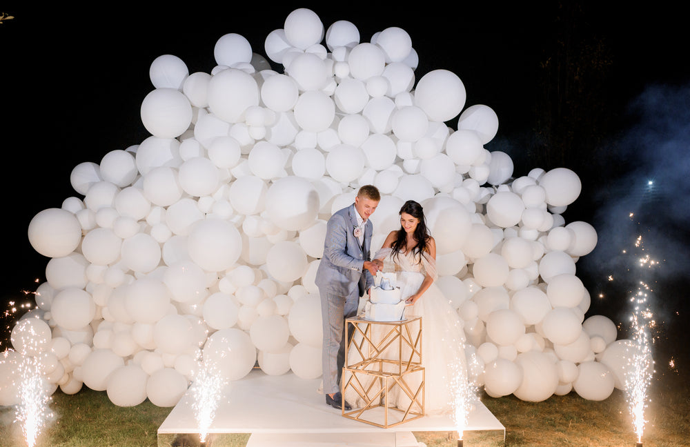 Feature image for this page, showcases the use of white Latex Balloons at a wedding.